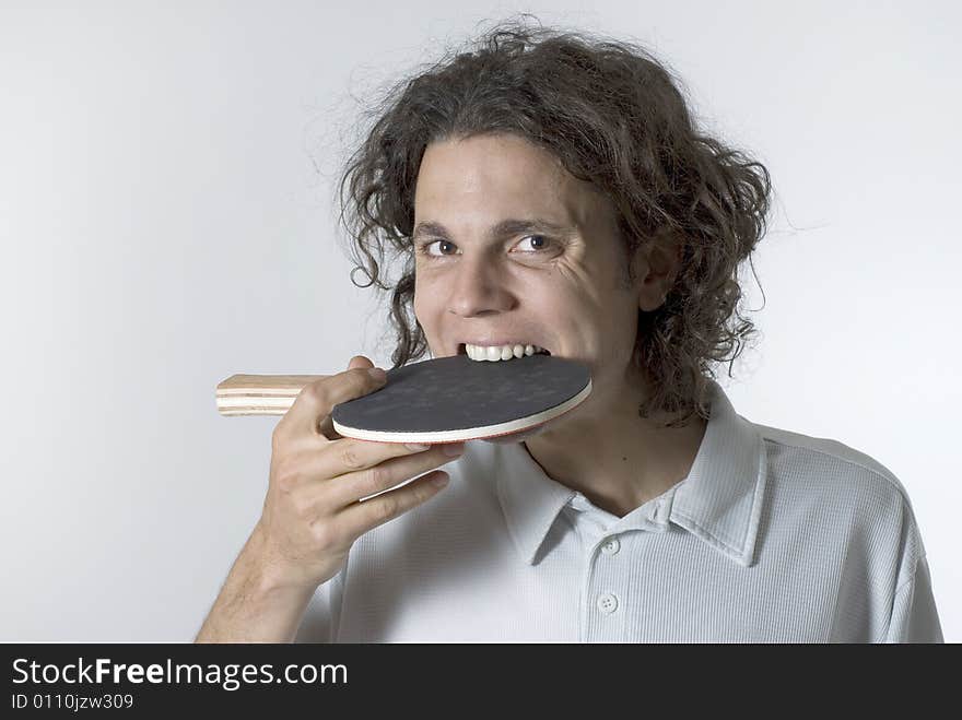 Man With Table Tennis Racket in Mouth - Horizontal