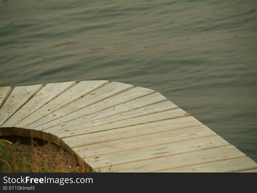 Wooden dock curve over river