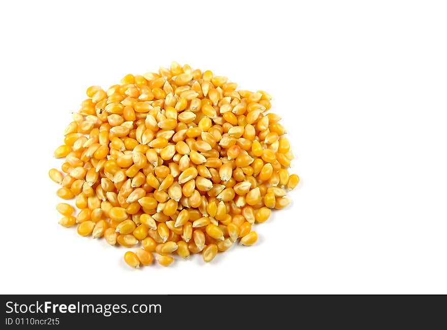 A photograph of popcorn seeds against a white background. A photograph of popcorn seeds against a white background