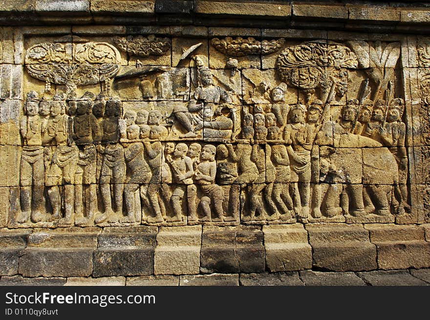 Indonesia, Central Java. The temple of Borobudur is a Mahayana Buddhist temple from the 9th century with a main shrine and several perforated stupas. View of the carved panels