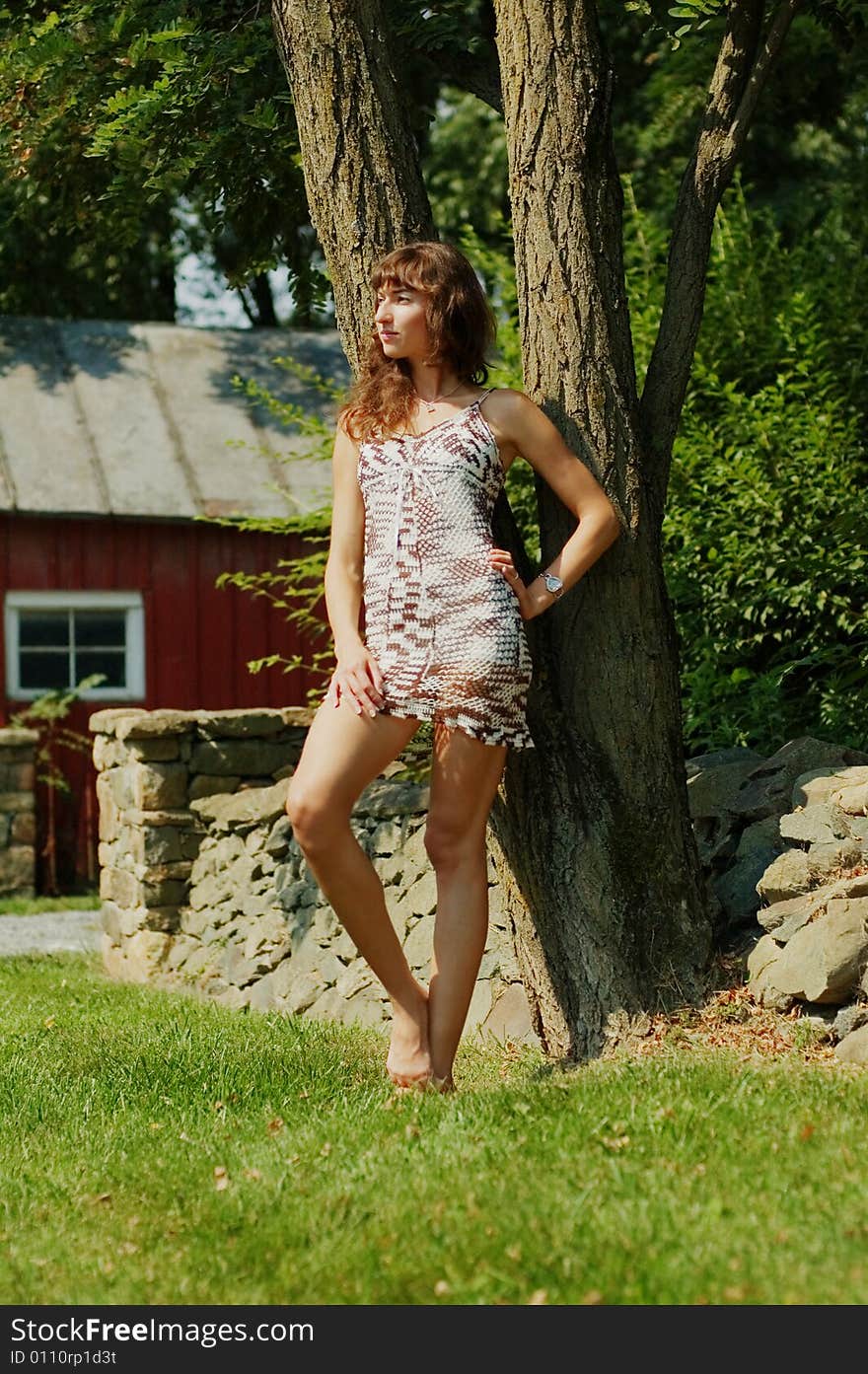 Girl Leaning Against Tree