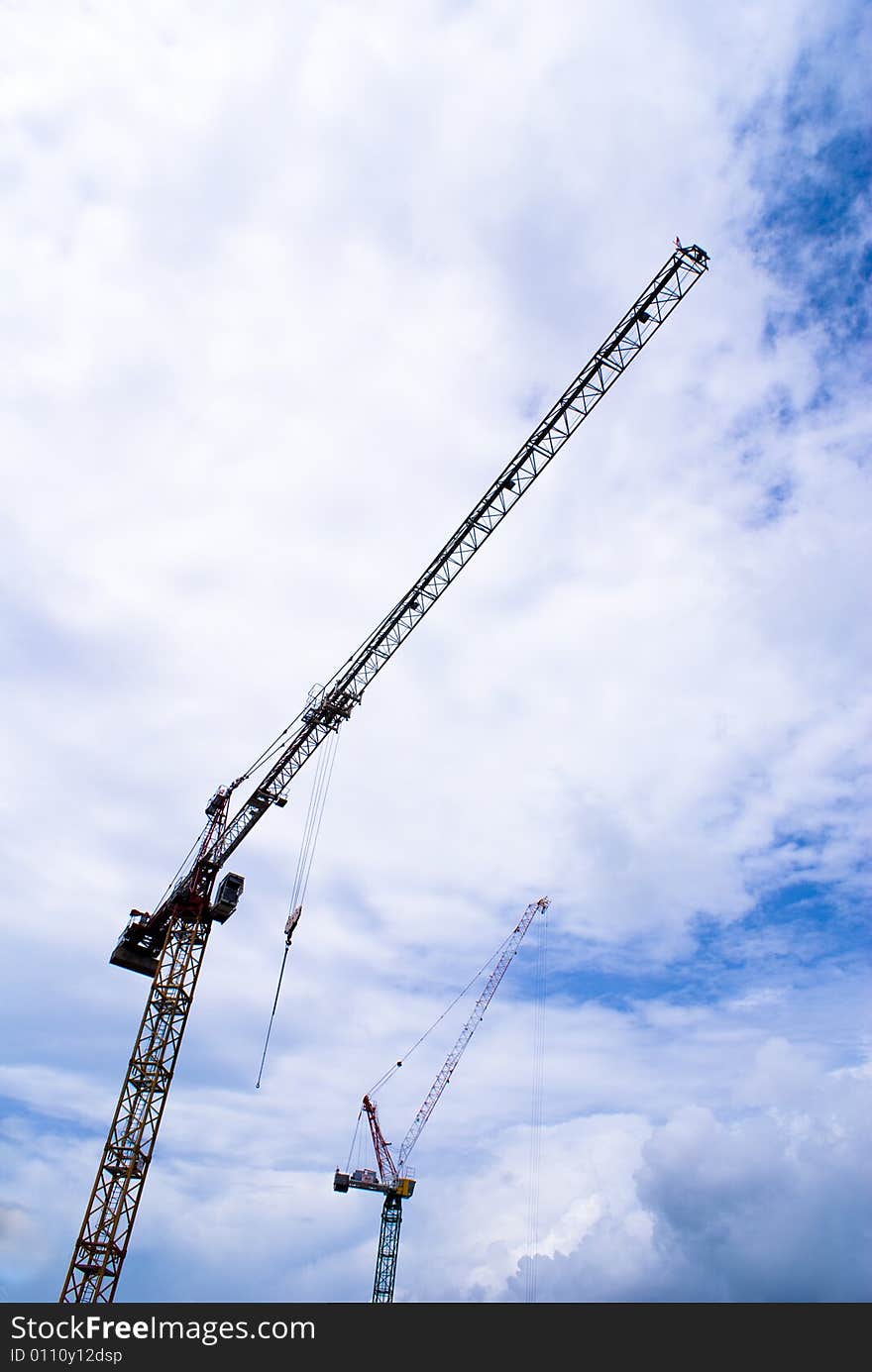 Long construction crane with blue sky as background. Long construction crane with blue sky as background