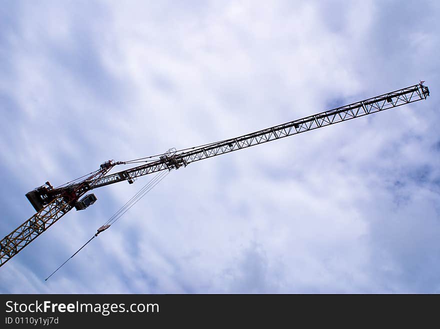 Long construction crane with blue sky as background. Long construction crane with blue sky as background