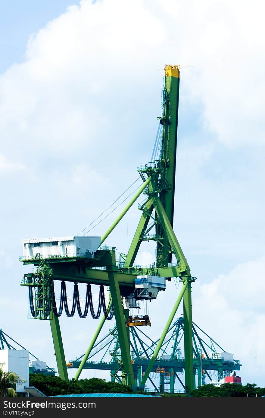 Huge modern port operating machines and containers in one of the busiest port in Asia. Huge modern port operating machines and containers in one of the busiest port in Asia.