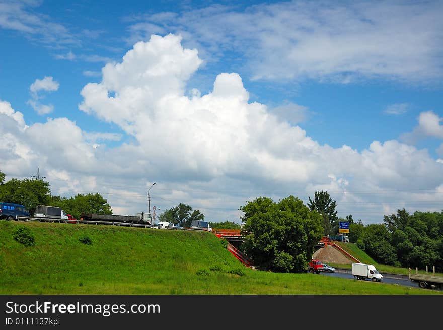 Summer, cloudy sky, view on road interchange