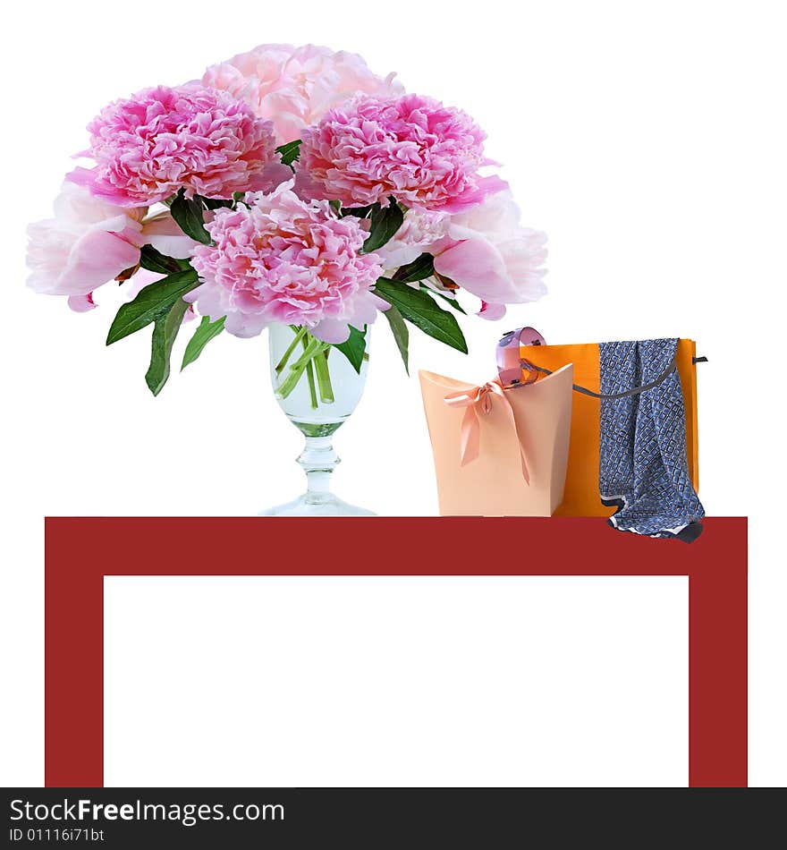 Peony and shopping bags with accessoires on the table