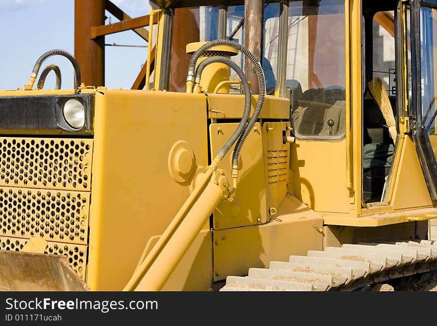 Close-up of an new yellow excavator. Close-up of an new yellow excavator.