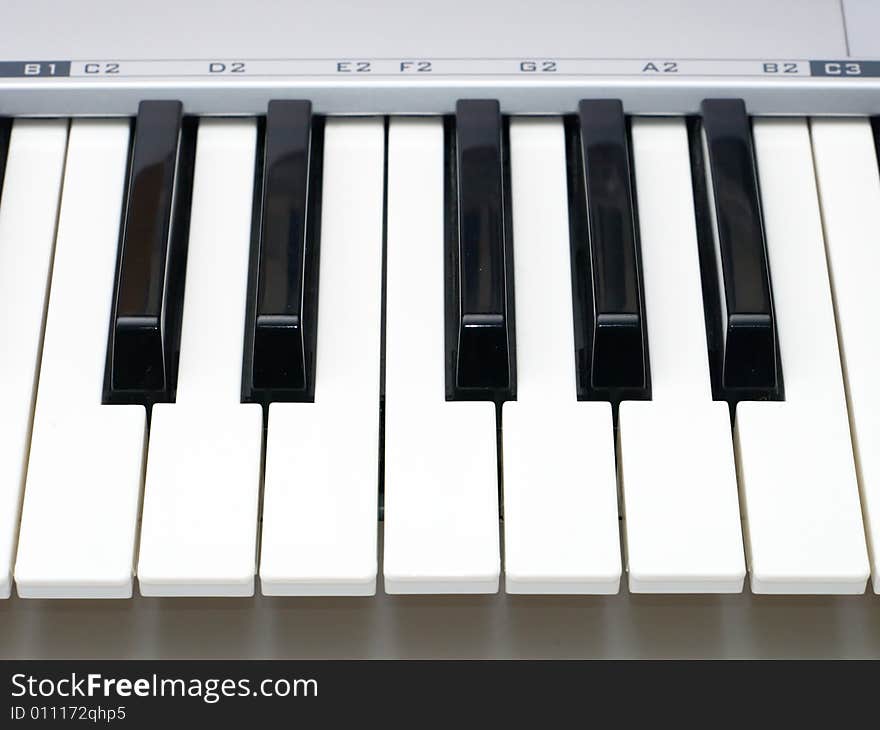 One Octave Of Midi Keyboard With Notes Letters Over Keys Close Up. One Octave Of Midi Keyboard With Notes Letters Over Keys Close Up