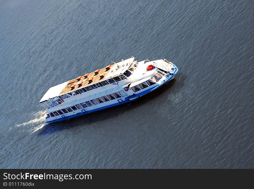 White cruise ship and calm sea.