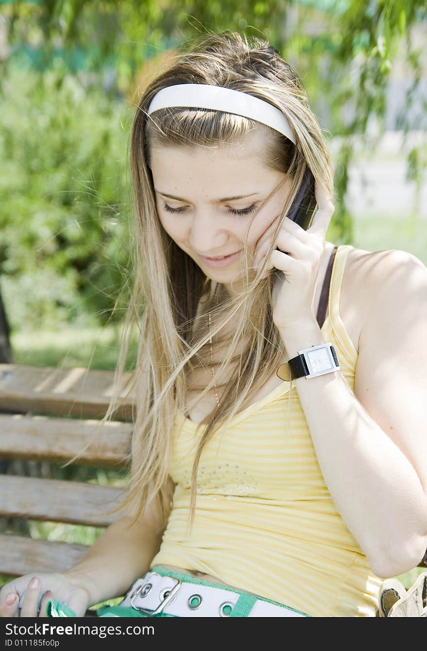 Young girl talking by phone