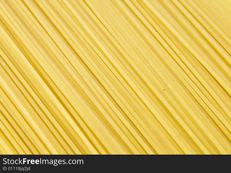 Background of yellow long spaghetti. Background of yellow long spaghetti