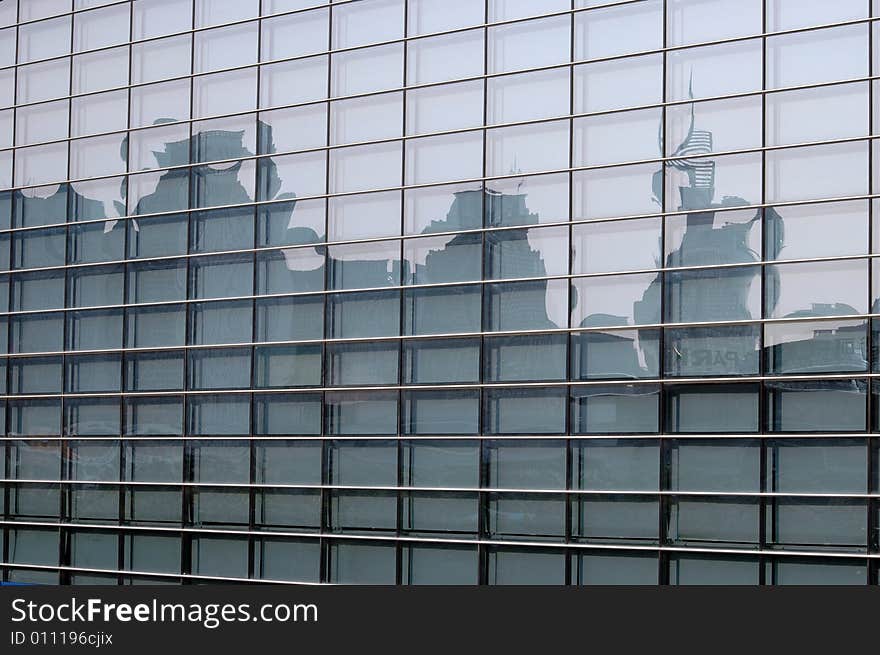 China, modern Chinese skyscrapers close photo - reflections in glass panel. China, modern Chinese skyscrapers close photo - reflections in glass panel.