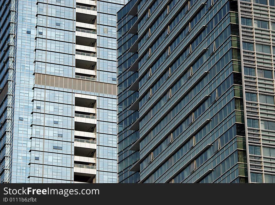 China, modern Chinese skyscrapers close photos - visable windows, glass panels, reflections, walls. China, modern Chinese skyscrapers close photos - visable windows, glass panels, reflections, walls.