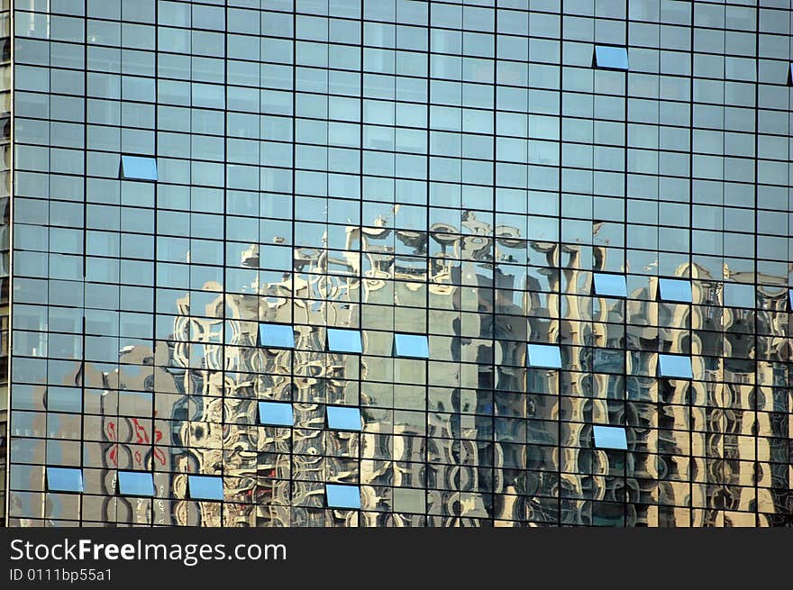 China, modern Chinese skyscrapers in reflection from glass panel of exhibition center. China, modern Chinese skyscrapers in reflection from glass panel of exhibition center.