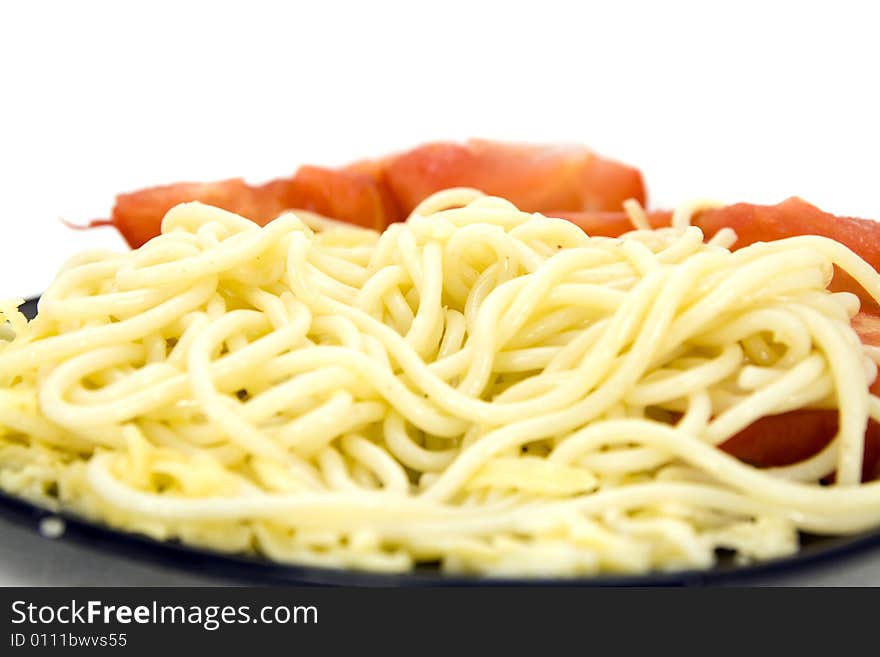 Macaroni with tomatoes on plate