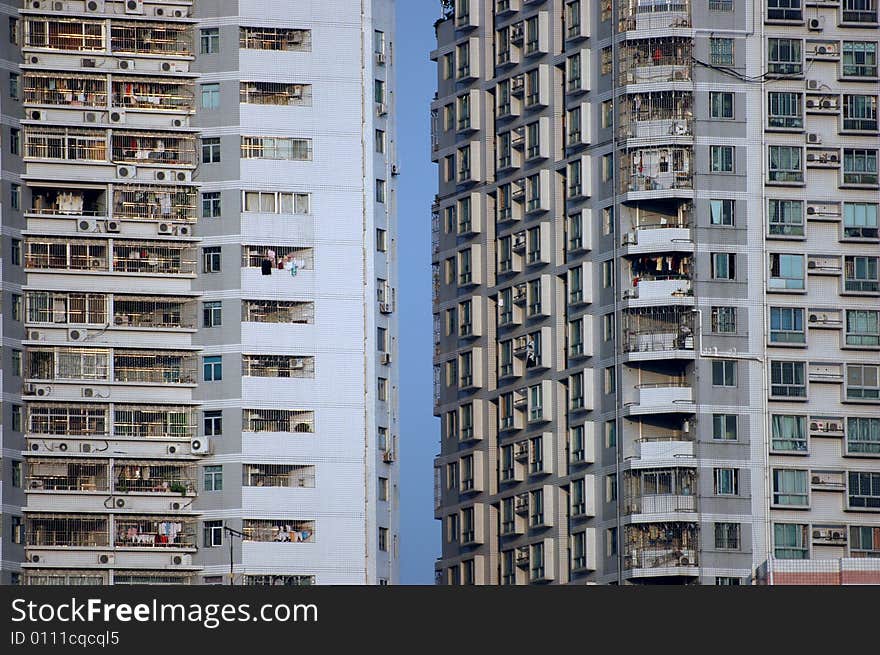 China, modern Chinese residential buildings with small gap between, hundreds of balconies and windows. China, modern Chinese residential buildings with small gap between, hundreds of balconies and windows.