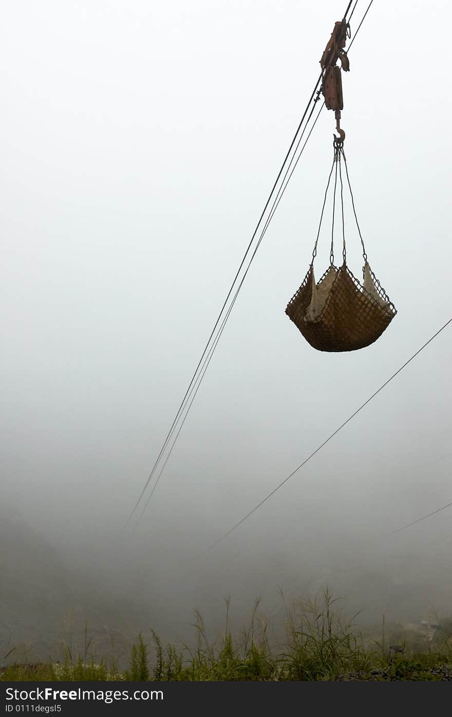 Old coalmine elevator in heavy fog.