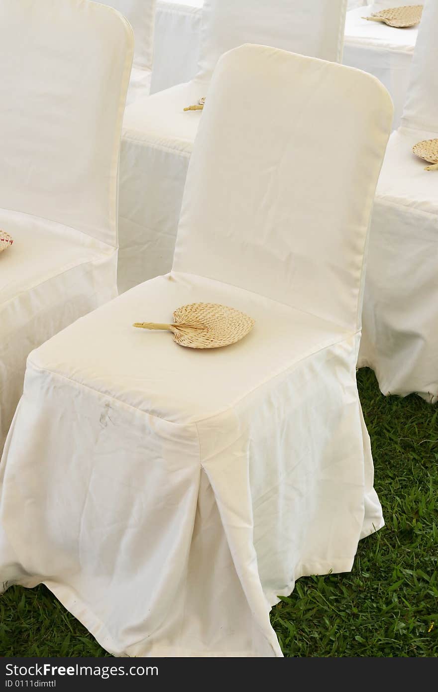 Chair with a fan at a wedding ceremony. Chair with a fan at a wedding ceremony.