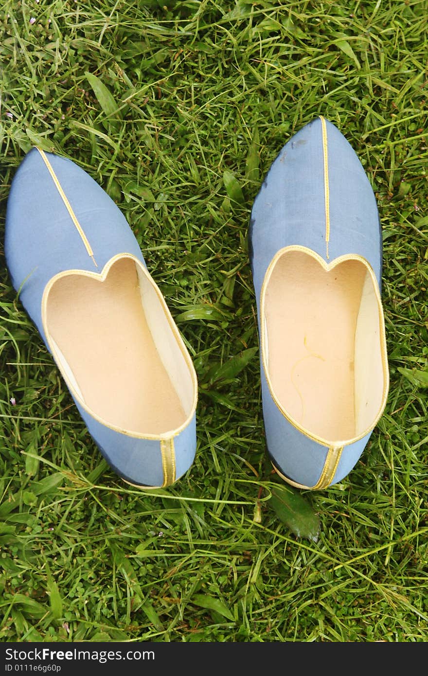 Pair of blue and gold Indian style shoes. Pair of blue and gold Indian style shoes.