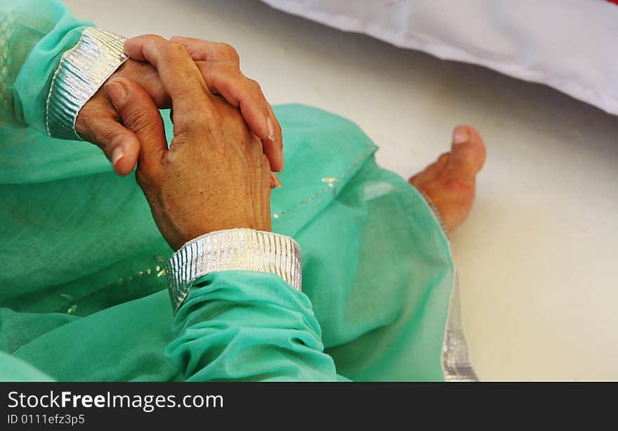 Close-up of a woman's hands at a traditional Indian wedding ceremony. Close-up of a woman's hands at a traditional Indian wedding ceremony.