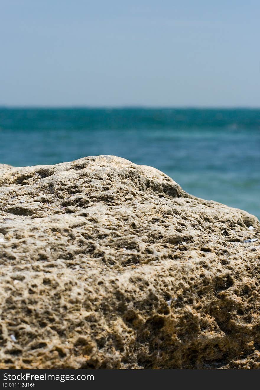 Rocky cliff and blue sea