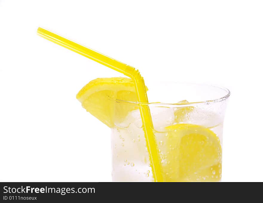 Cold drink with ice and lemons isolated