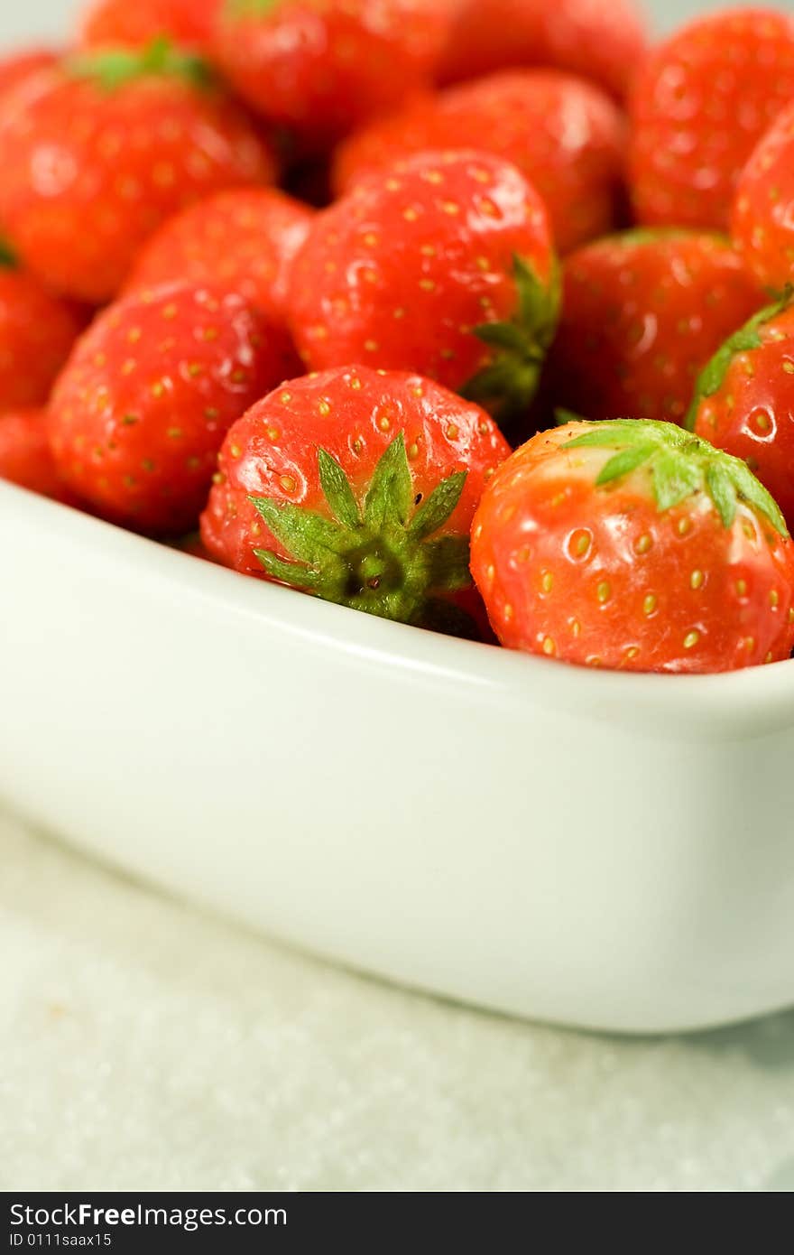 Strawberry in white bowl on white background. Strawberry in white bowl on white background