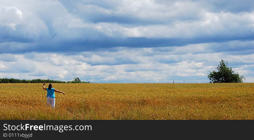 Shot of a young woman enjoying a summer walk. Shot of a young woman enjoying a summer walk