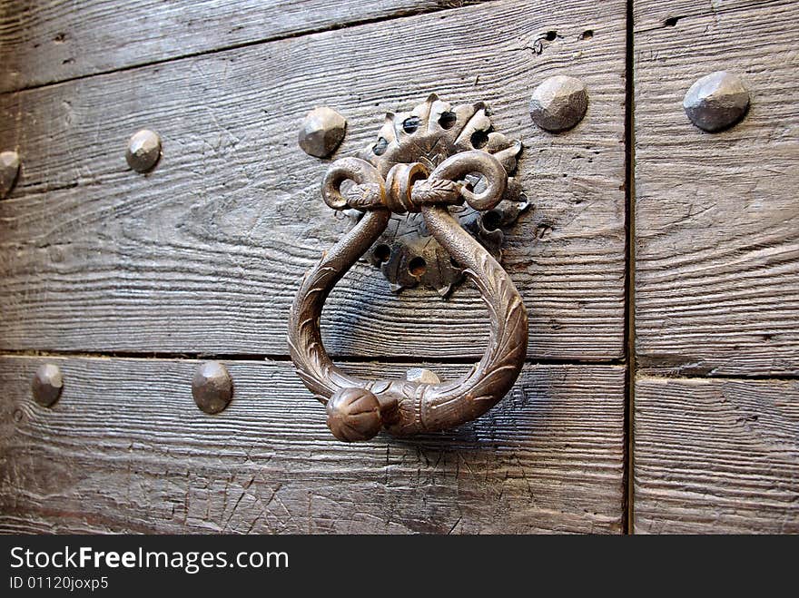 Detail of an ancient wooden door. Detail of an ancient wooden door.