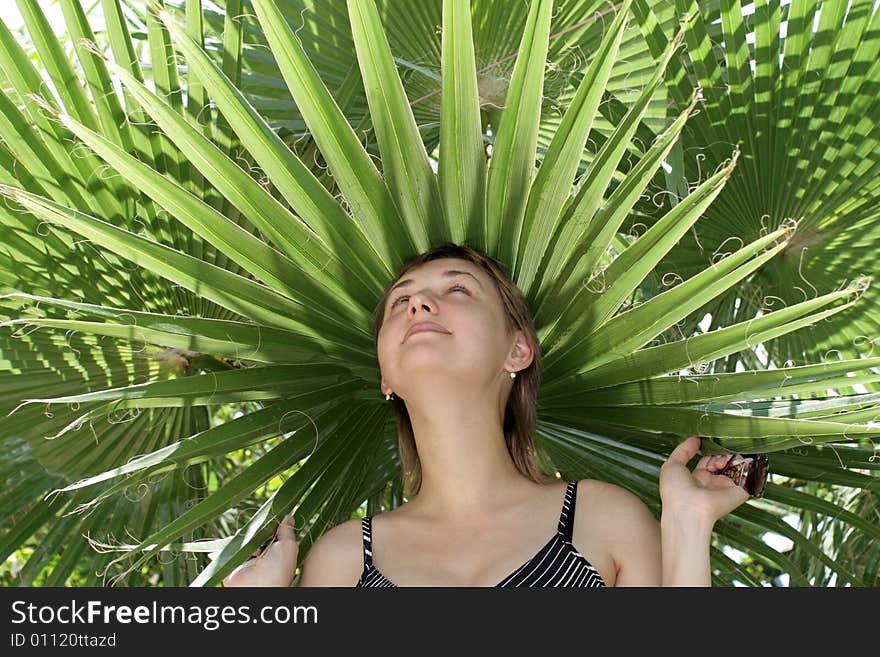 The girl hides face from the sun