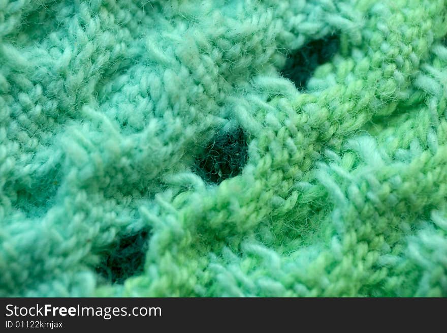 Macro pattern of green - light-blue textile fabric