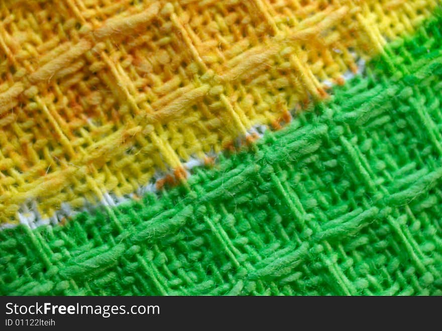 Macro pattern of yellow - green textile fabric