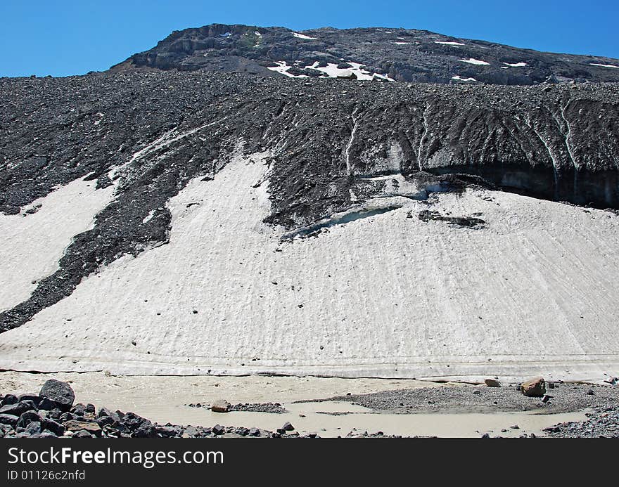 Rocks and mountain covered with snow