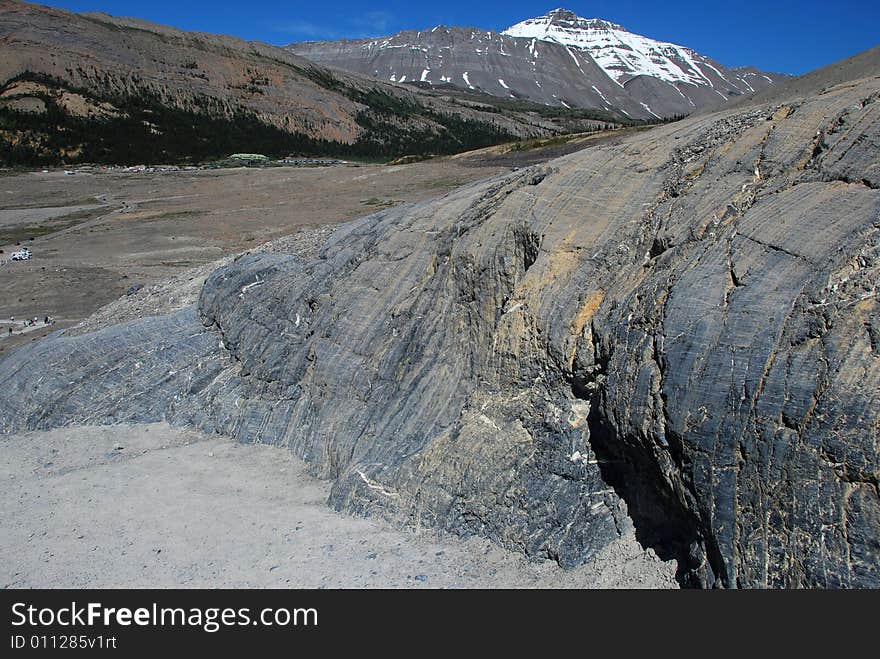 Rocks and snow mountain near Columbia Glacier in Rockies Icefield National Park