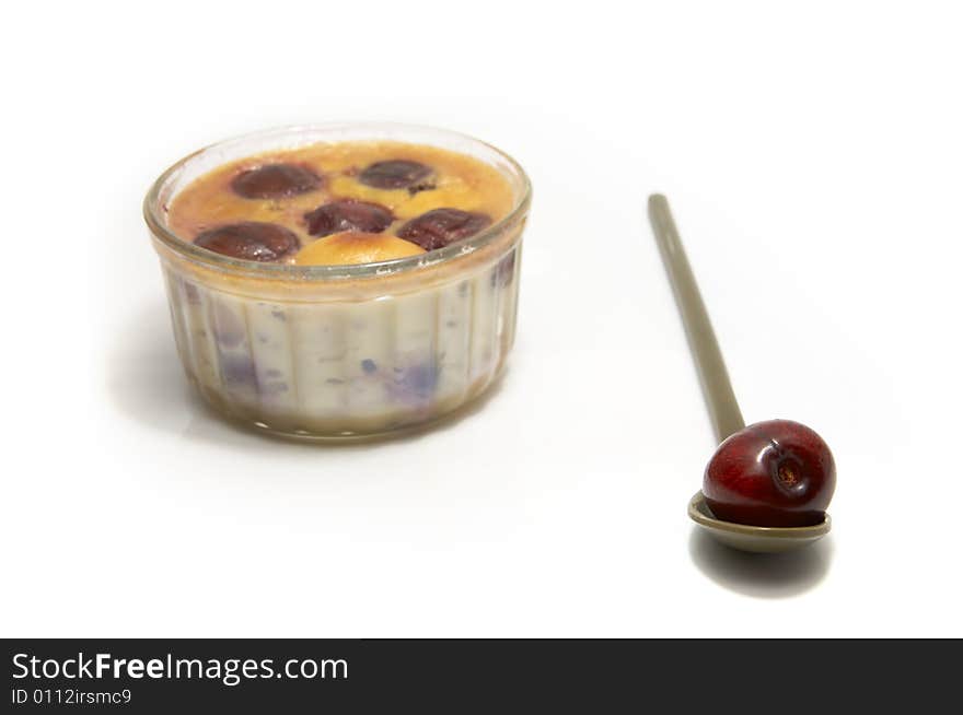 An individual clafoutis with cherries in a ramequin