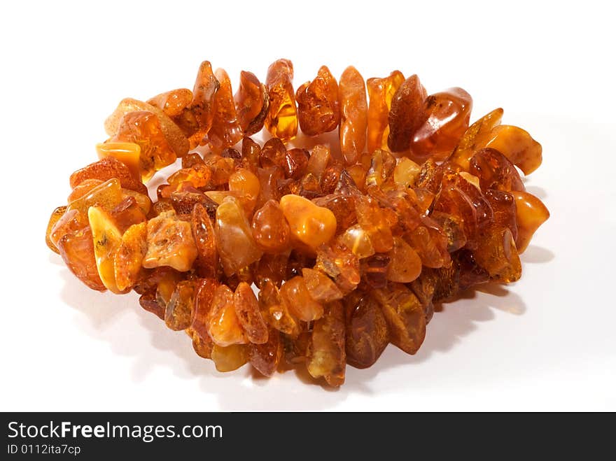 Thread of amber bead on white background. close-up. Thread of amber bead on white background. close-up.