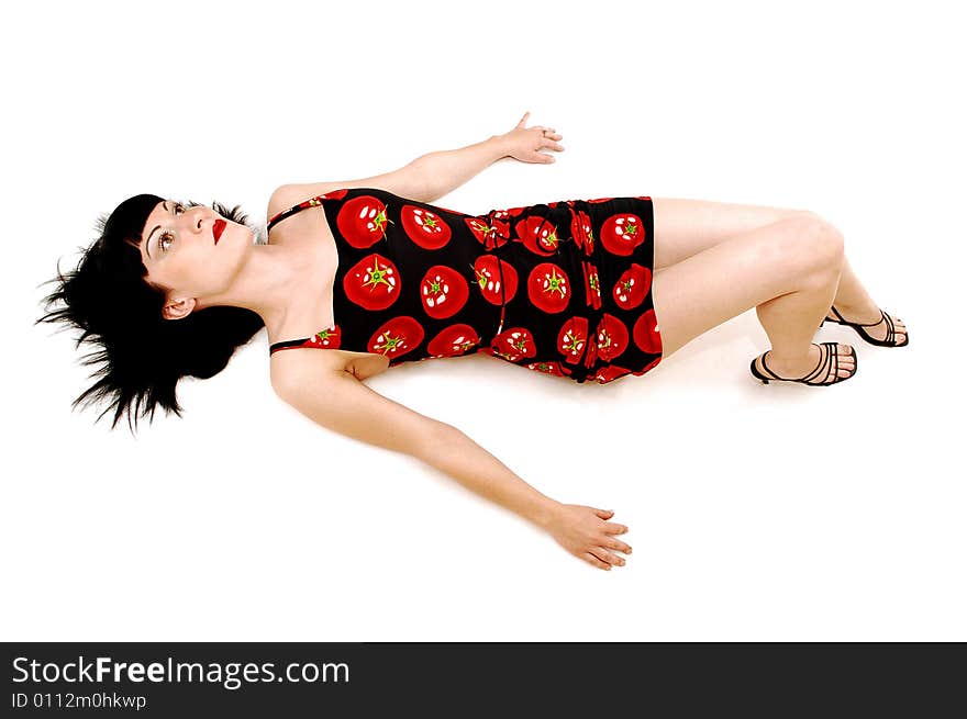 A young pretty woman lying on the floor and having fun
in her tomato printed dress, for white background. A young pretty woman lying on the floor and having fun
in her tomato printed dress, for white background.