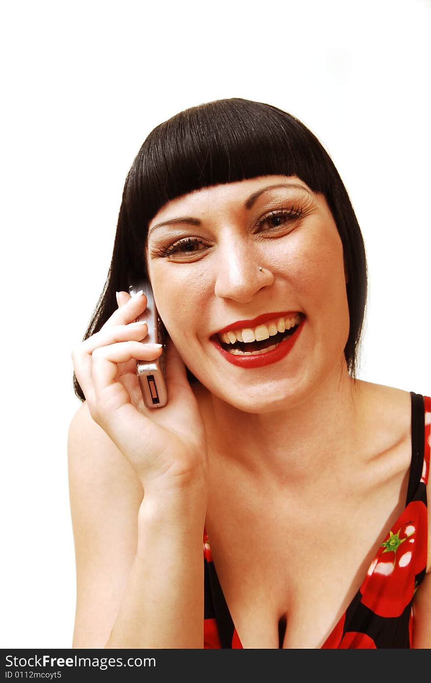 A young pretty woman in a studio and having fun talking
on the cell phone for white background in a tomato print dress. A young pretty woman in a studio and having fun talking
on the cell phone for white background in a tomato print dress.