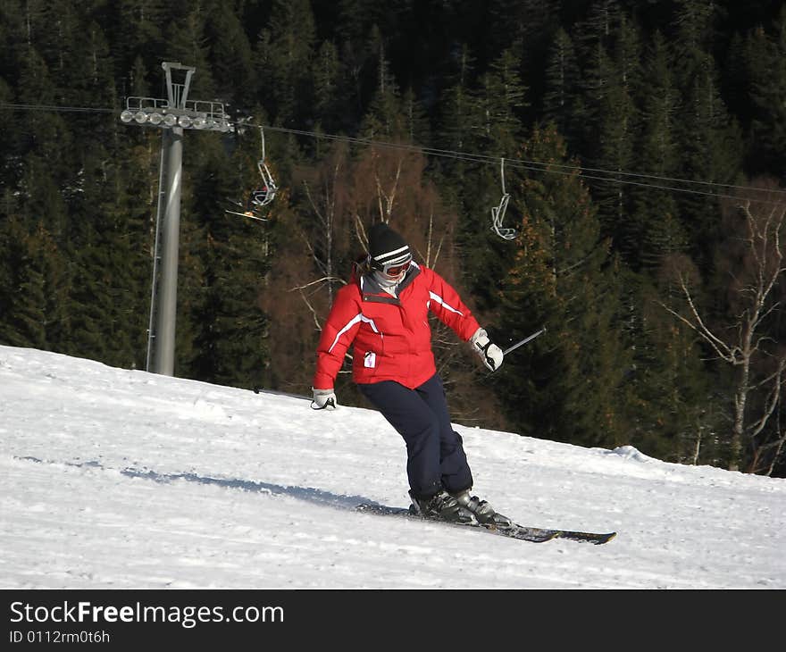 Woman on ski on the slope