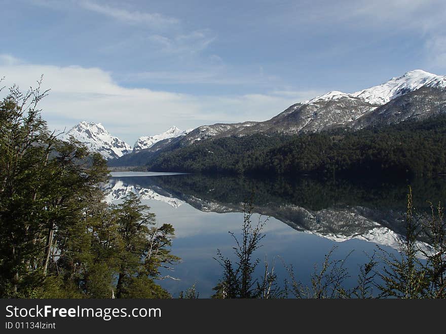 The mountains are reflected on the lake. The mountains are reflected on the lake