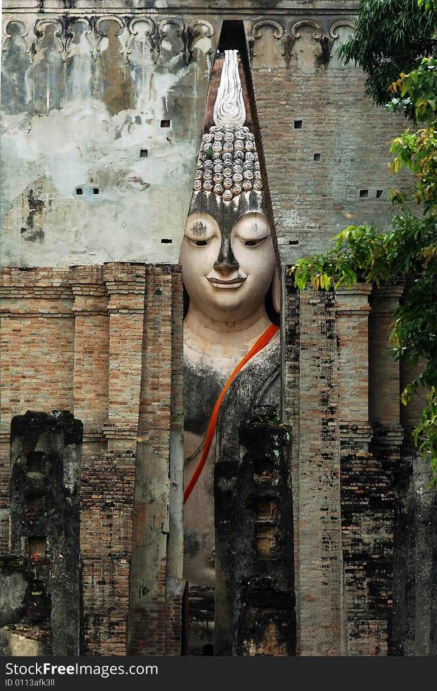 Thailand, Sukhothai or Sukothai was the capital of the Thai Empire founded in 1238. Detail of a seated Buddha at Wat Si Chum, Phra Atchana or Ajana. Thailand, Sukhothai or Sukothai was the capital of the Thai Empire founded in 1238. Detail of a seated Buddha at Wat Si Chum, Phra Atchana or Ajana.