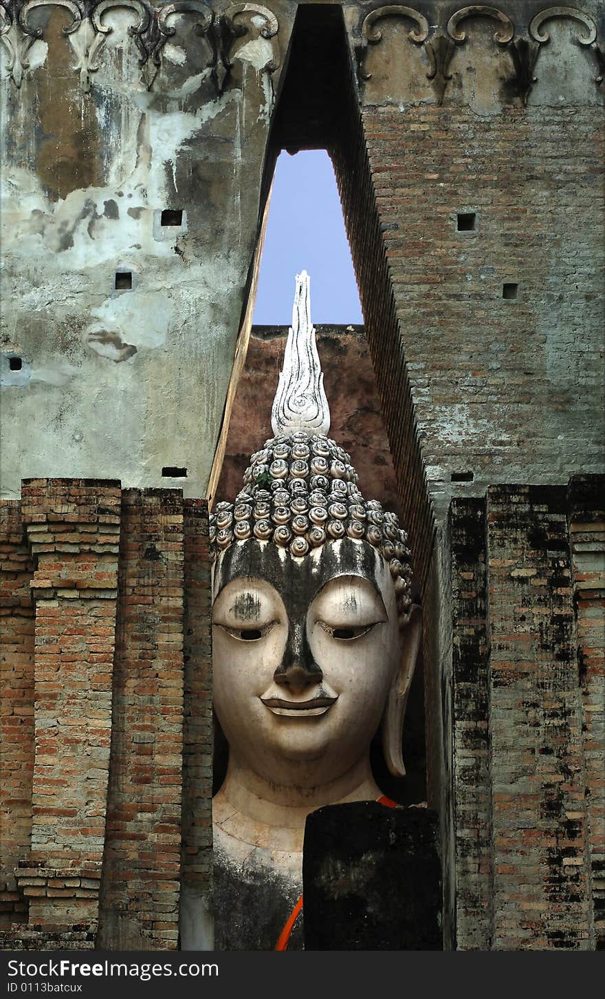 Thailand, Sukhothai or Sukothai was the capital of the Thai Empire founded in 1238. Detail of a seated Buddha at Wat Si Chum, Phra Atchana or Ajana. Thailand, Sukhothai or Sukothai was the capital of the Thai Empire founded in 1238. Detail of a seated Buddha at Wat Si Chum, Phra Atchana or Ajana.