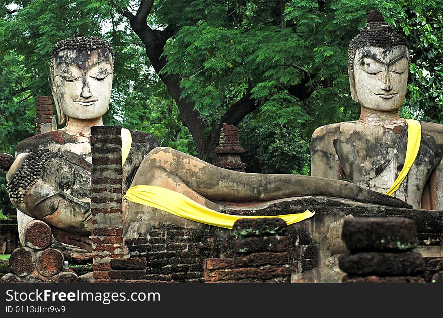 Thailand, KAMPHAENG PHET:the historical park is situated in the north of the country. View of one seated and one reclining Buddhas. Thailand, KAMPHAENG PHET:the historical park is situated in the north of the country. View of one seated and one reclining Buddhas