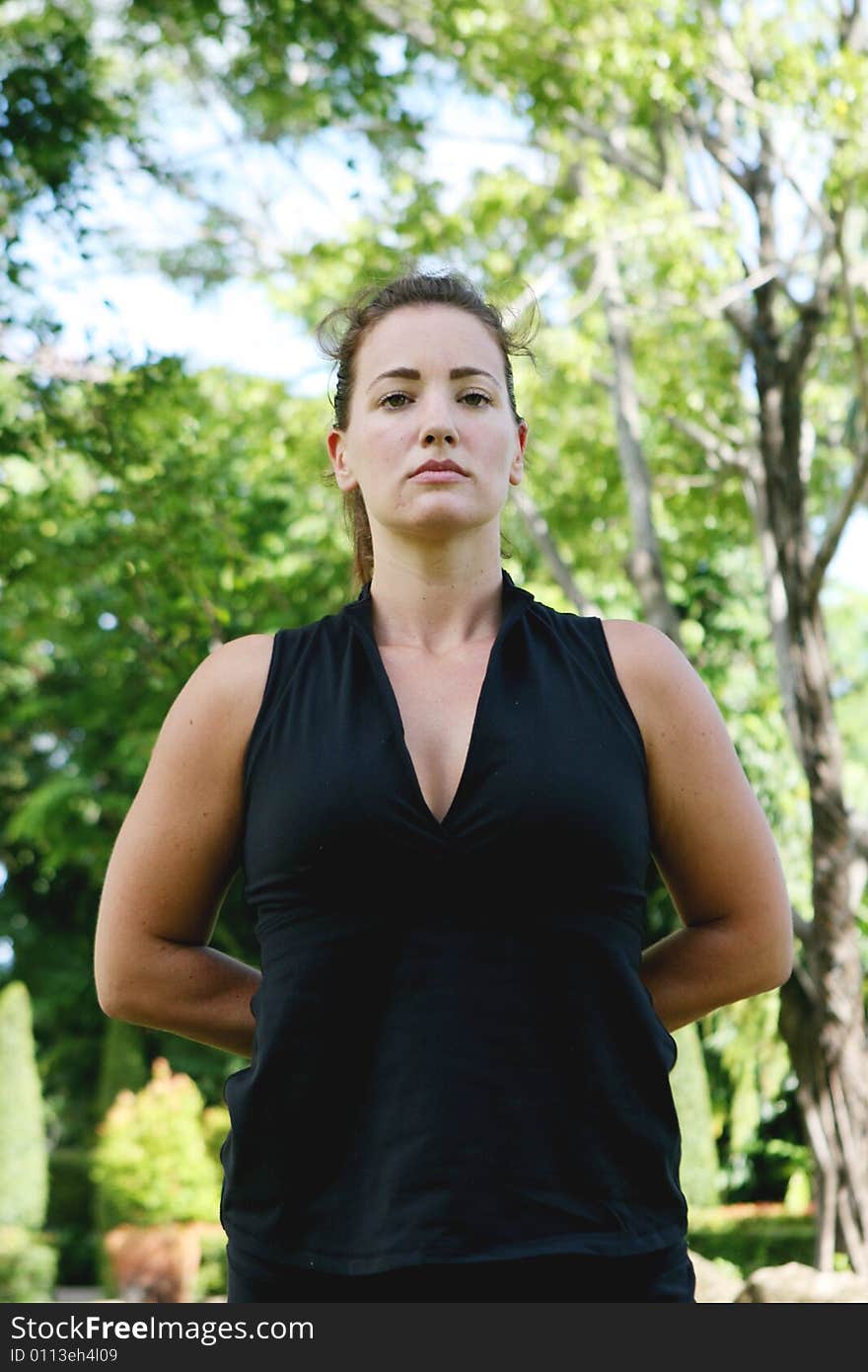 Young woman practicing yoga in the park.