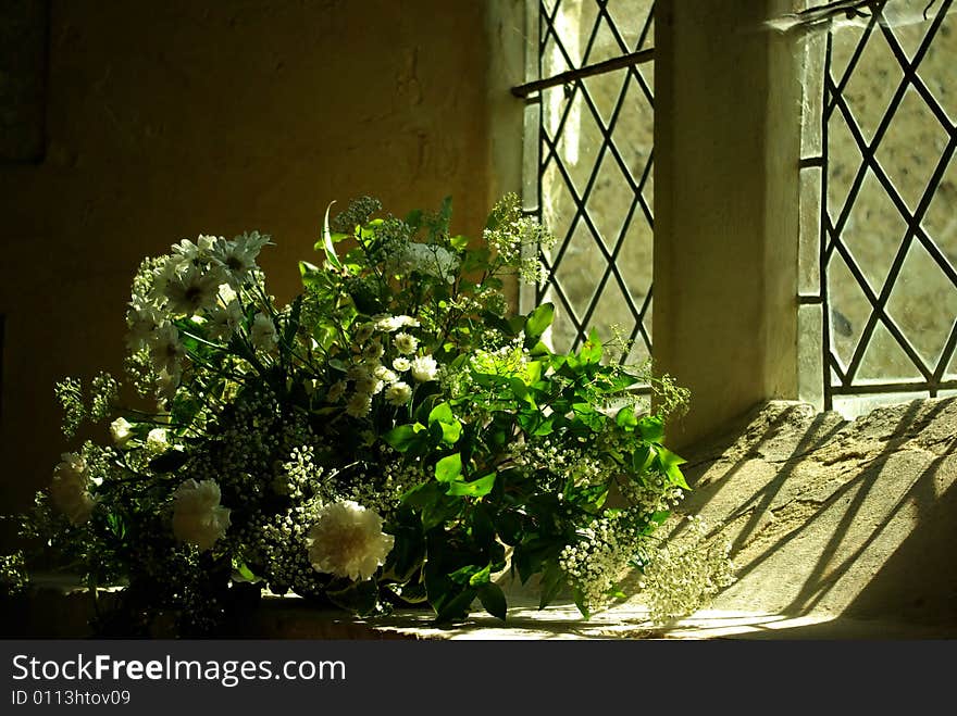 Bouquet of white roses in a church for a wedding. Bouquet of white roses in a church for a wedding.