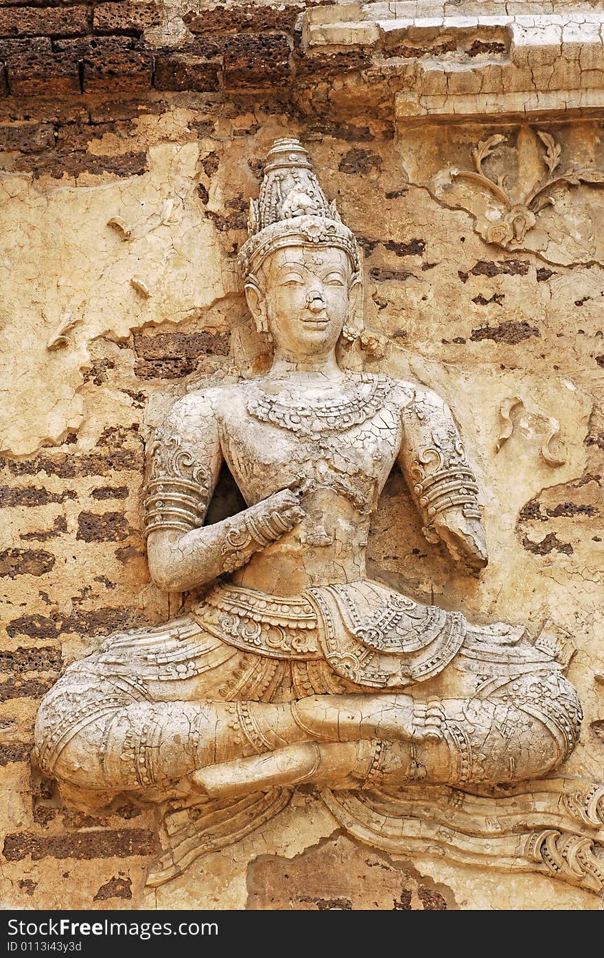 Thailand Chiang Mai: Wat Jedyod temple; view of one carved image representing a seated Buddha on the outsider walls