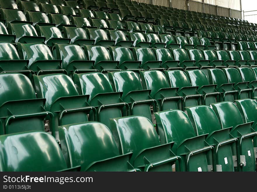 Rows of green stadium seats