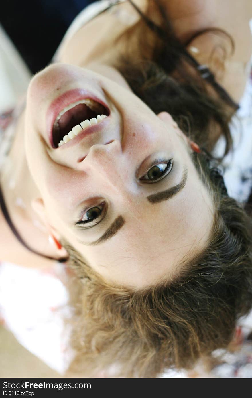 Close-up portrait of a woman laughing and having fun.