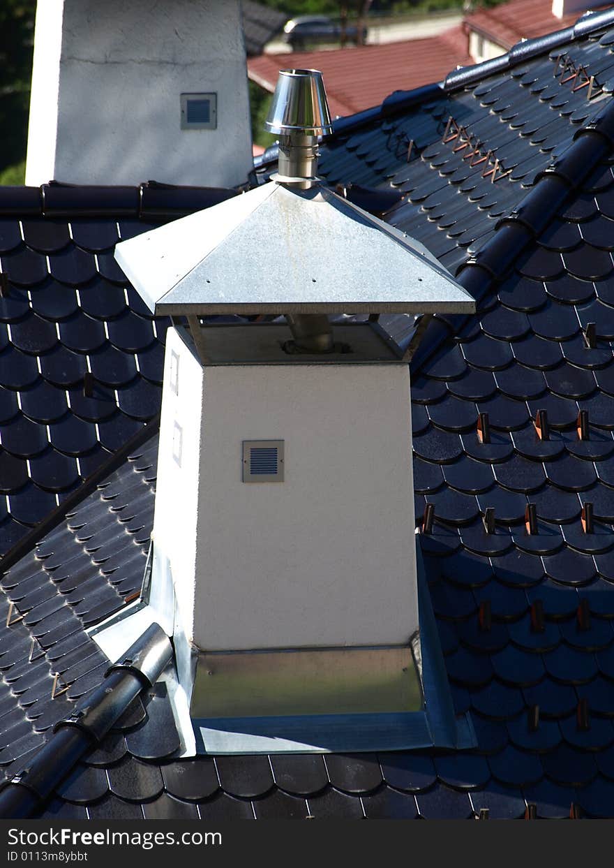 A particular chimney on a slate's roof