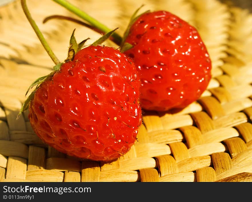 Strawberry in basket on bright summer day